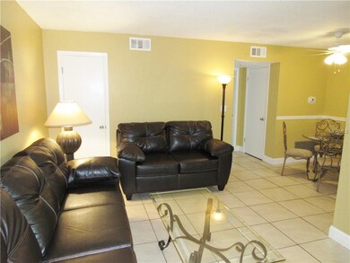 Living area showing adjoining dining area.