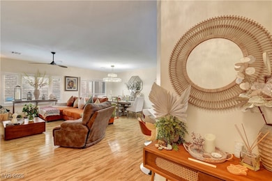 Living area with wood finished floors, a ceiling f