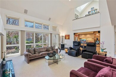 Volume ceiling and walls of windows accent the Gre