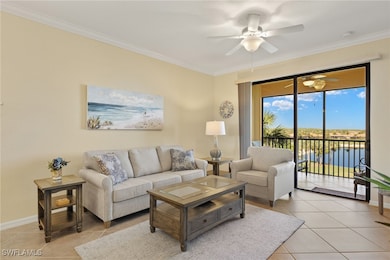 Living room with ceiling fan, light tile patterned