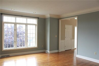This comfortable family room features a transom at