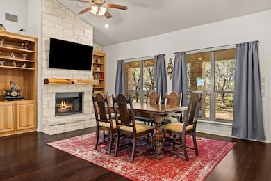Dining room featuring lofted ceiling, dark wood-s