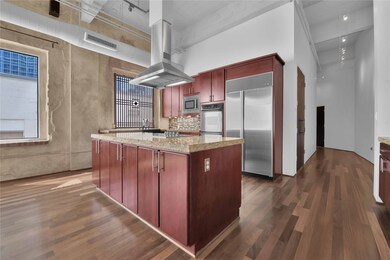 Cherry cabinets, cook top in island, built in sub
