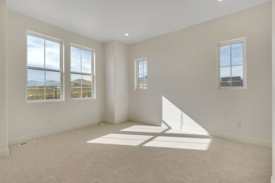 Unfurnished room with carpet, recessed lighting, and a mountain view