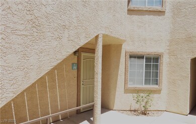 Property entrance featuring stucco siding