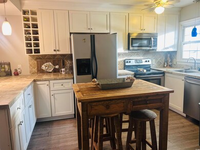 Kitchen featuring dark hardwood / wood-style floor