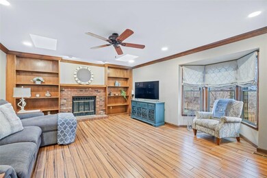 Great room with fireplace, built in bookshelves, s