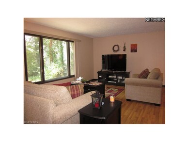 Large picture windows drenches the living room in 