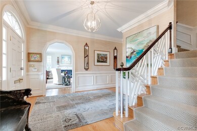 Gracious Entrance Hall with arched entryways to fo