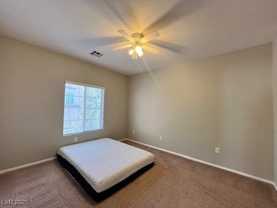 Bedroom with baseboards, carpet, and a ceiling fan