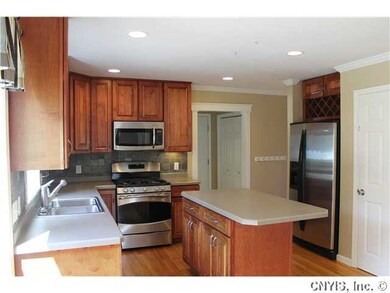 Kitchen. Stainless steel appliances, a wine rack, 