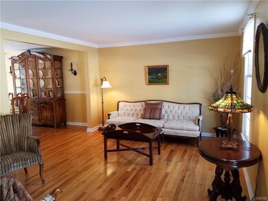 Crown molding in this open living room and hardwoo