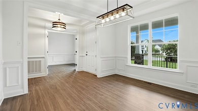 As you enter, you'll be greeted by a formal dining room w/ tray ceiling and a home office with glass French doors located directly off the foyer. 
