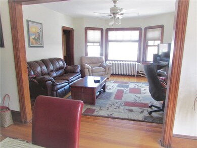 Large open living room with hardwood floors and to