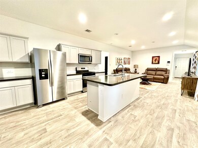 Kitchen with lots of storage and counter space. Open concept and great for entertaining