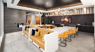 Community lobby with tile walls and a sink