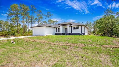 View of front of property with concrete driveway,