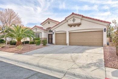 Mediterranean / spanish home with a garage, drivew