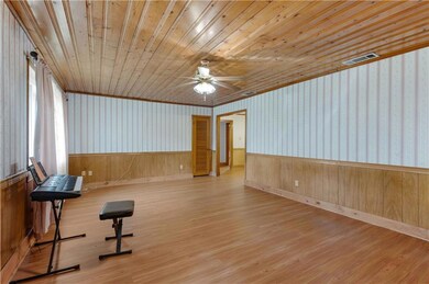 Exercise area featuring wood-type flooring, wooden