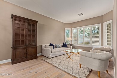 Formal living room with natural light.