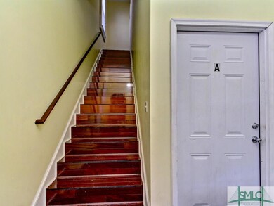 Inside front door; staircase leads to apartment B