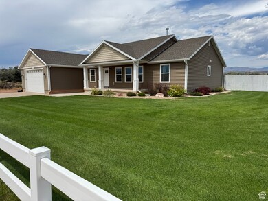 Single story home with a porch, a shingled roof, driveway, and a garage