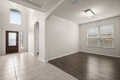 Entrance foyer featuring arched walkways and ligh