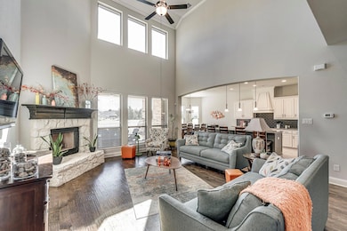 Love the stone fireplace with a hearth. Also, love