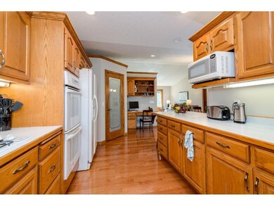 Large galley kitchen with custom Oak Cabinets