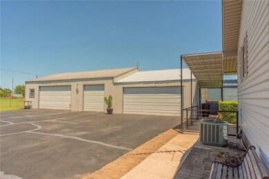 Lots of parking space + 5 car Garage/shop with off