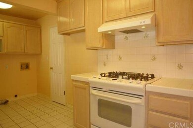 Custom high end stove and hood, laundry area on le