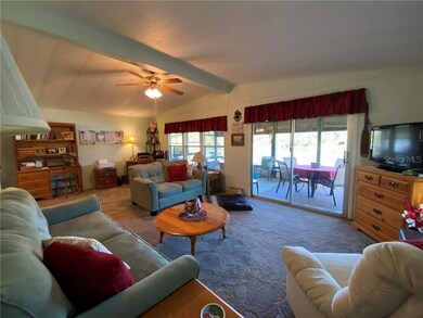 Spacious living area opens onto large screened por