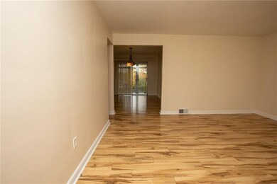 A view of the living room to the dining room and o