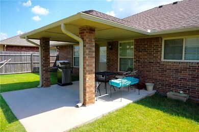 Covered back patio with extended concrete