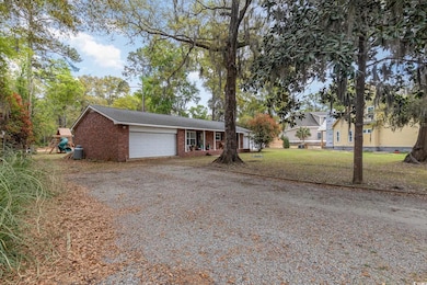 Ranch-style home with an attached garage, a front 