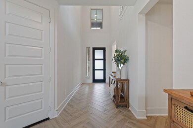 A stunning entryway with high ceilings, modern des