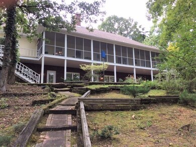 Main floor screened porch is 57 feet overlooking l