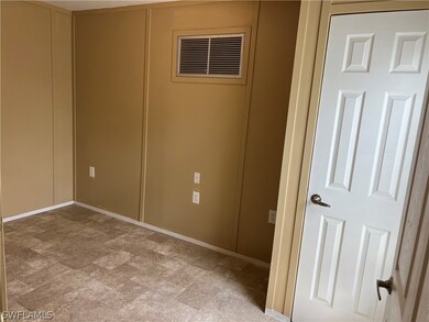 Unfurnished room with tile floors