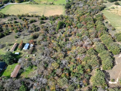 Birds eye view of property featuring a rural view