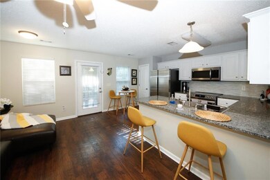 Kitchen featuring stainless steel appliances, back