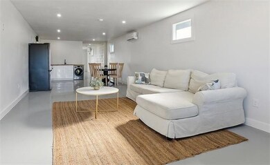 Inside, the open-concept living space is a masterc