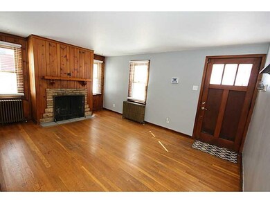 Living Room. Hardwood floors and a wood burning fi
