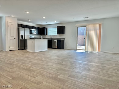 Kitchen featuring stainless steel appliances, open