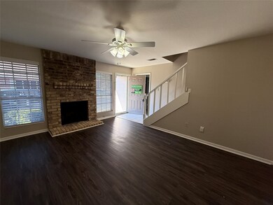 Den with luxury vinyl plank floors.