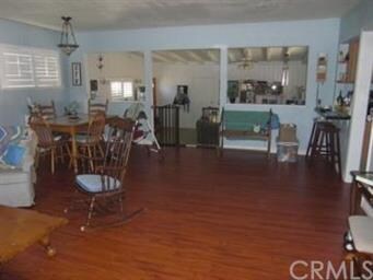View from front door thru living room to step-down