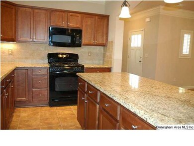 Large open kitchen with granite counters.