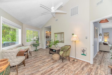 Sitting room featuring wood finished floors, high 