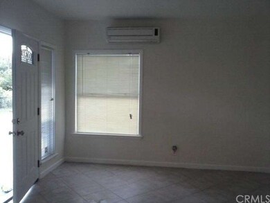 Living room with ductless a/c and heat unit