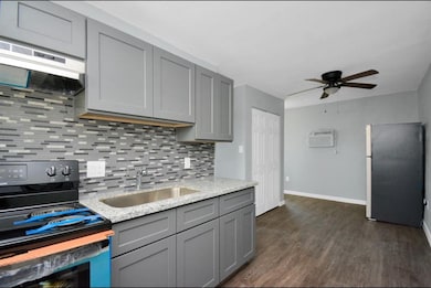Stainless sink and granite countertops.