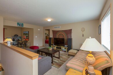 living room showing entry to basement